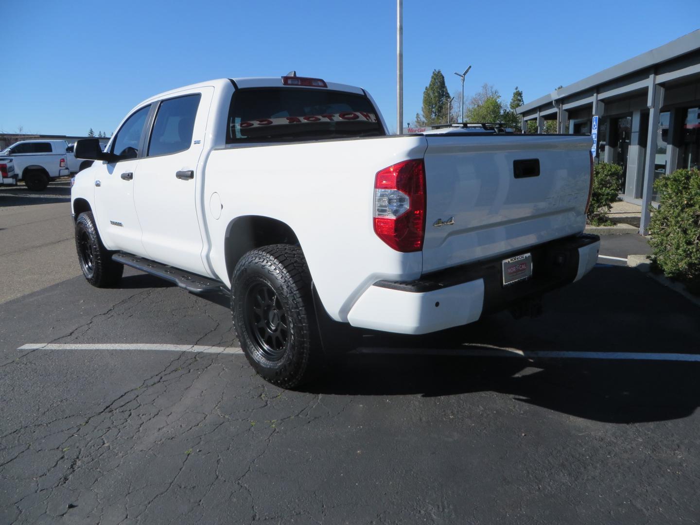 2020 White /GREY Toyota Tundra SR5 (5TFDY5F19LX) with an 5.7L engine, automatic transmission, located at 2630 Grass Valley Highway, Auburn, CA, 95603, (530) 508-5100, 38.937893, -121.095482 - Features - King Off Road adjustable remote reservoir coil overs, King 2.5 adjustable remote reservoir rear shocks, Method Race wheels, Falken Wildpeak tires, Sliders, Bed braces, Borla Exhaust, Husky floor mats, Window tint, and Ram phone mounts. - Photo#6